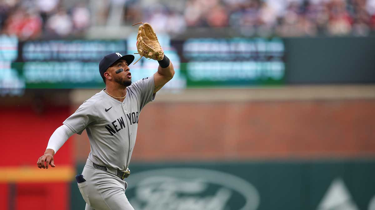 New York Yankees third baseman Oswald Peraza (18) catches a pop fly against the Atlanta Braves in the first inning at Truist Park. 