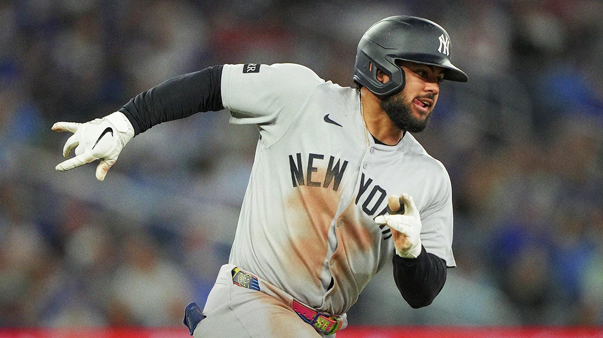 New York Yankees left fielder Jasson Dominguez (24) runs out his double against the Toronto Blue Jays during the ninth inning at Rogers Centre.