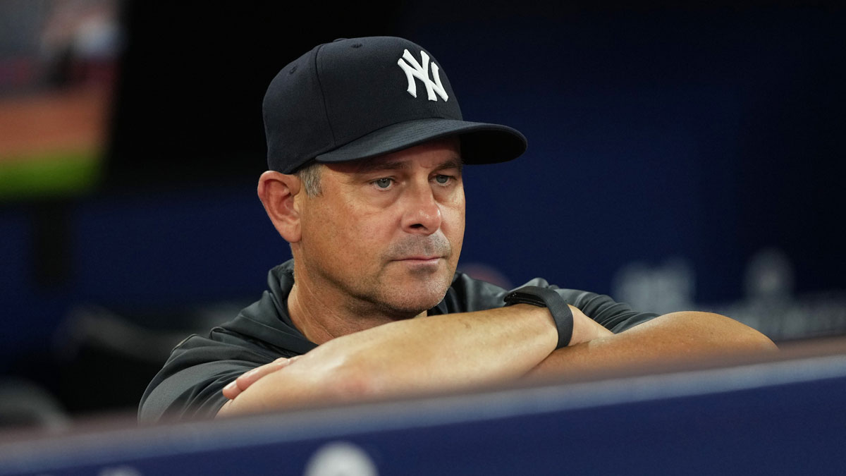 New York Yankees manager Aaron Boone (17) watches batting practice before a game against the Toronto Blue Jays at Rogers Centre.