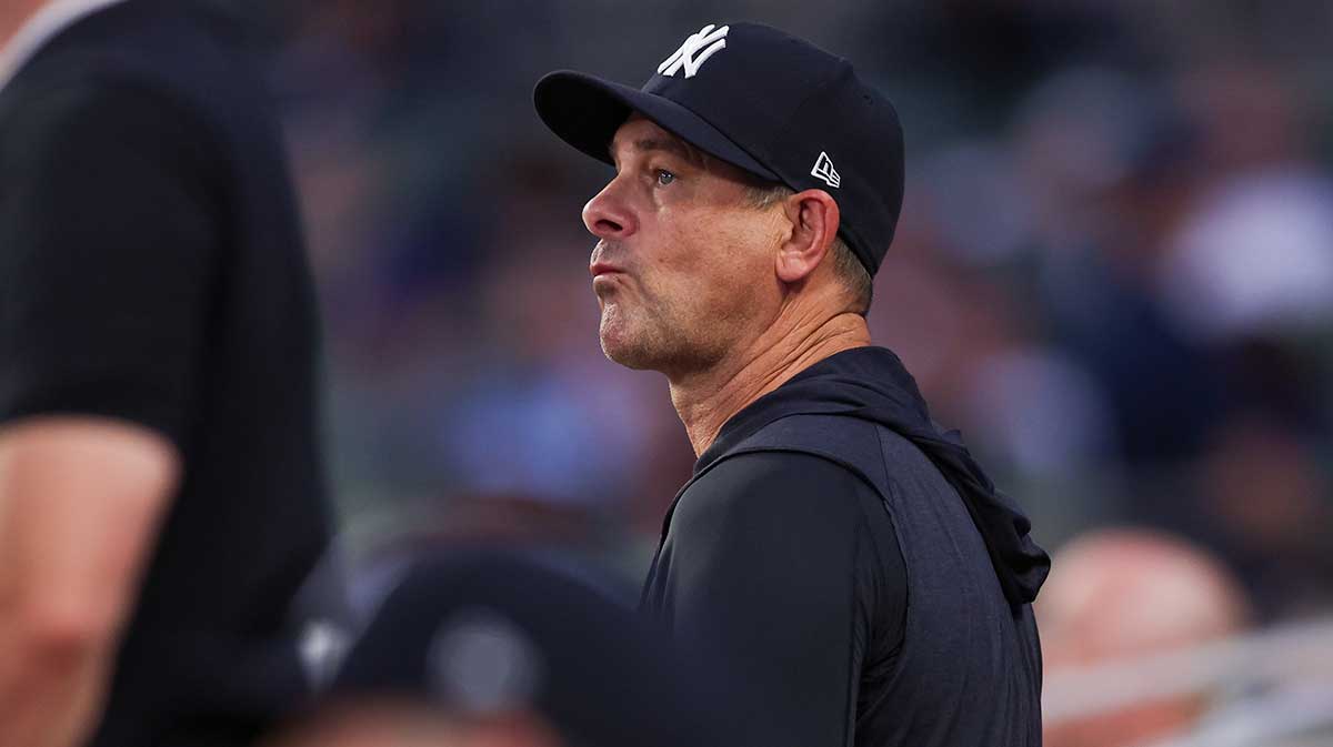 New York Yankees manager Aaron Boone (17) in the dugout against the Atlanta Braves in the fifth inning at Truist Park.
