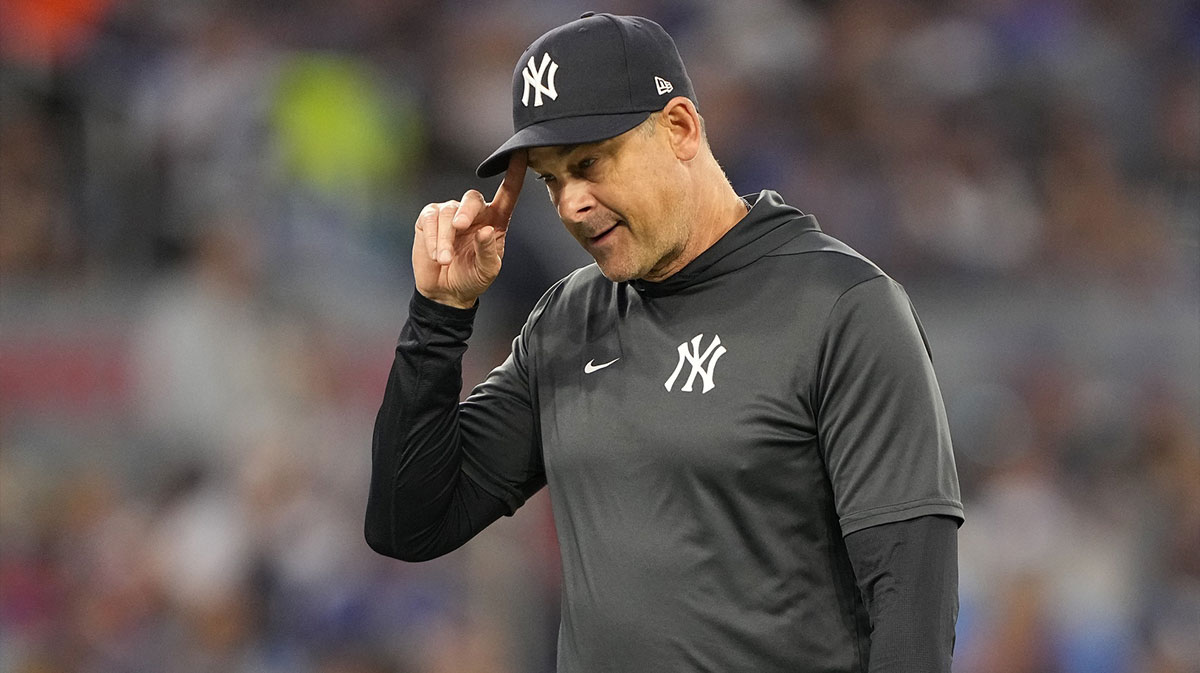 New York Yankees manager Aaron Boone walks to the dug out after making a pitching change against the Toronto Blue Jays during the fifth inning at Rogers Centre. Mandatory Credit: John E. Sokolowski-Imagn Images