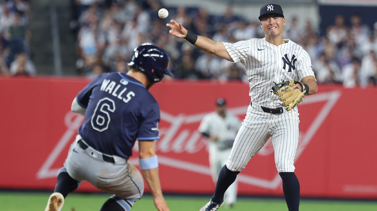 Yankees shortstop Anthony Volpe (11) forces out