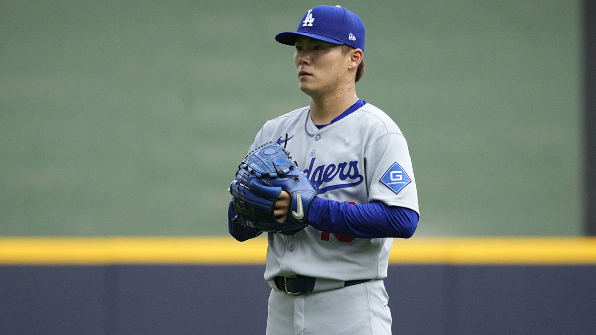 Los Angeles Dodgers pitcher Yoshinobu Yamamoto (18) warms up before taking the mound against the Milwaukee Brewers at American Family Field.