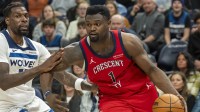 New Orleans Pelicans forward Zion Williamson (1) drives to the basket past Minnesota Timberwolves center Naz Reid (11) in the second half at Target Center.