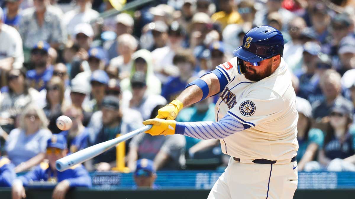 Seattle Mariners first baseman Rowdy Tellez (23) hits a double against the Cleveland Guardians during the second inning at T-Mobile Park. Rangers promoted Tellez from Triple-A Round Rock ahead of All-Star break return.