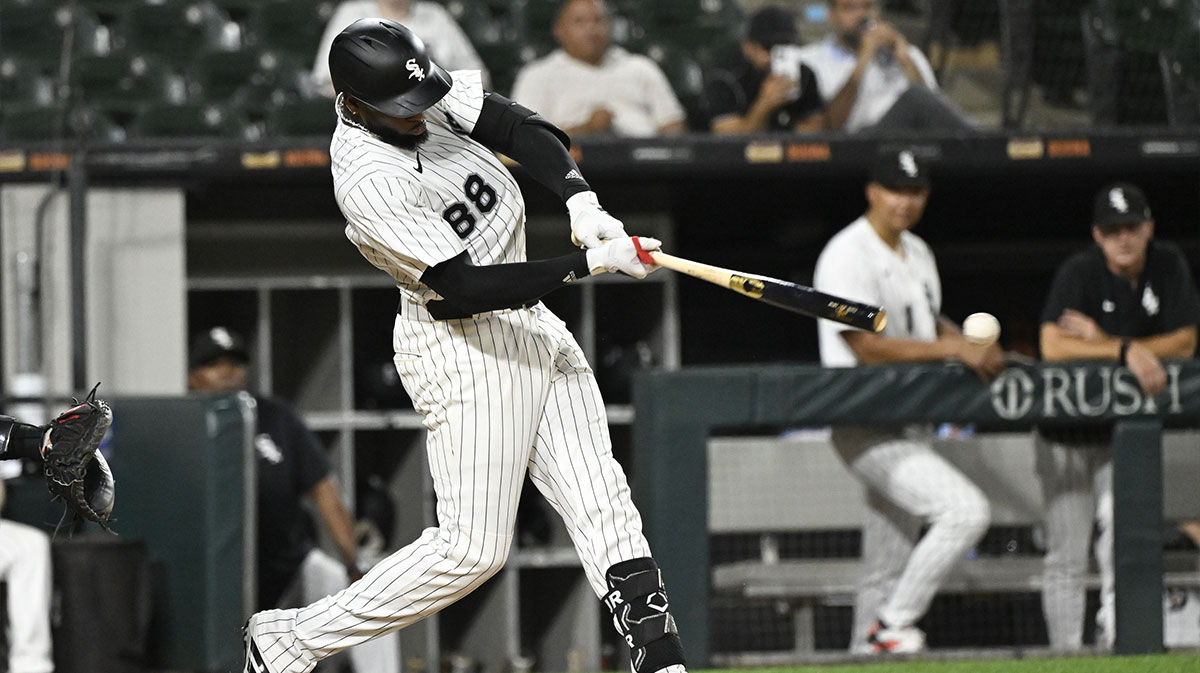 Chicago White Sox outfielder Luis Robert Jr. (88) hits a single during the ninth inning against the Arizona Diamondbacks at Rate Field.