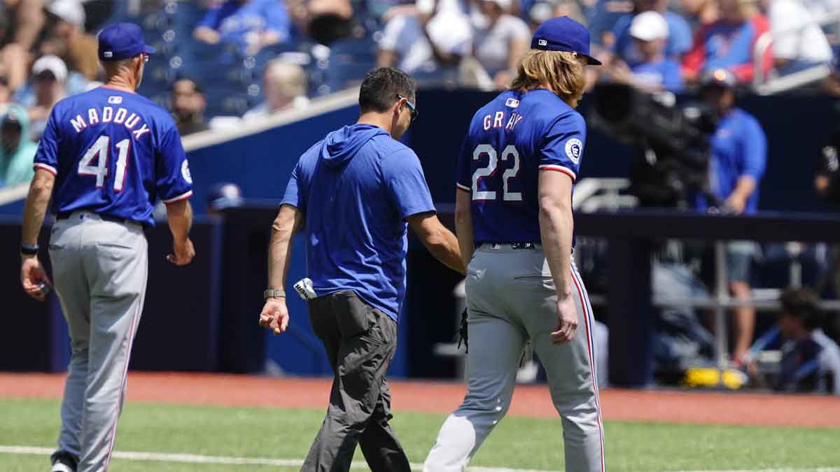 Texas Rangers pitcher Jon Gray (22) comes out of the game before throwing a pitch against the Toronto Blue Jays in the first inning at Rogers Centre.