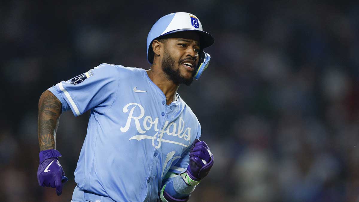 Kansas City Royals third baseman Maikel Garcia (11) runs after hitting a double against the Chicago Cubs during the eight inning at Wrigley Field. Mandatory Credit: Kamil Krzaczynski-Imagn Images