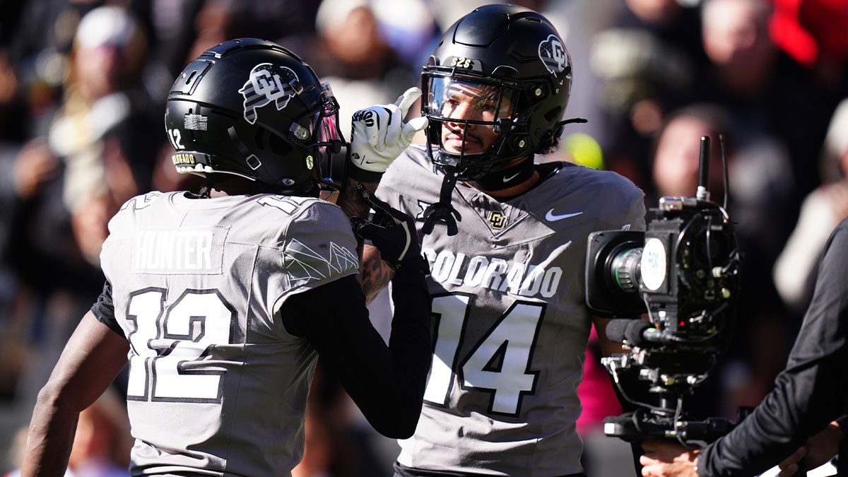 Colorado Buffaloes wide receiver Will Sheppard (14) celebrates his touchdown with wide receiver Travis Hunter (12) in the first quarter against the Utah Utes at Folsom Field.