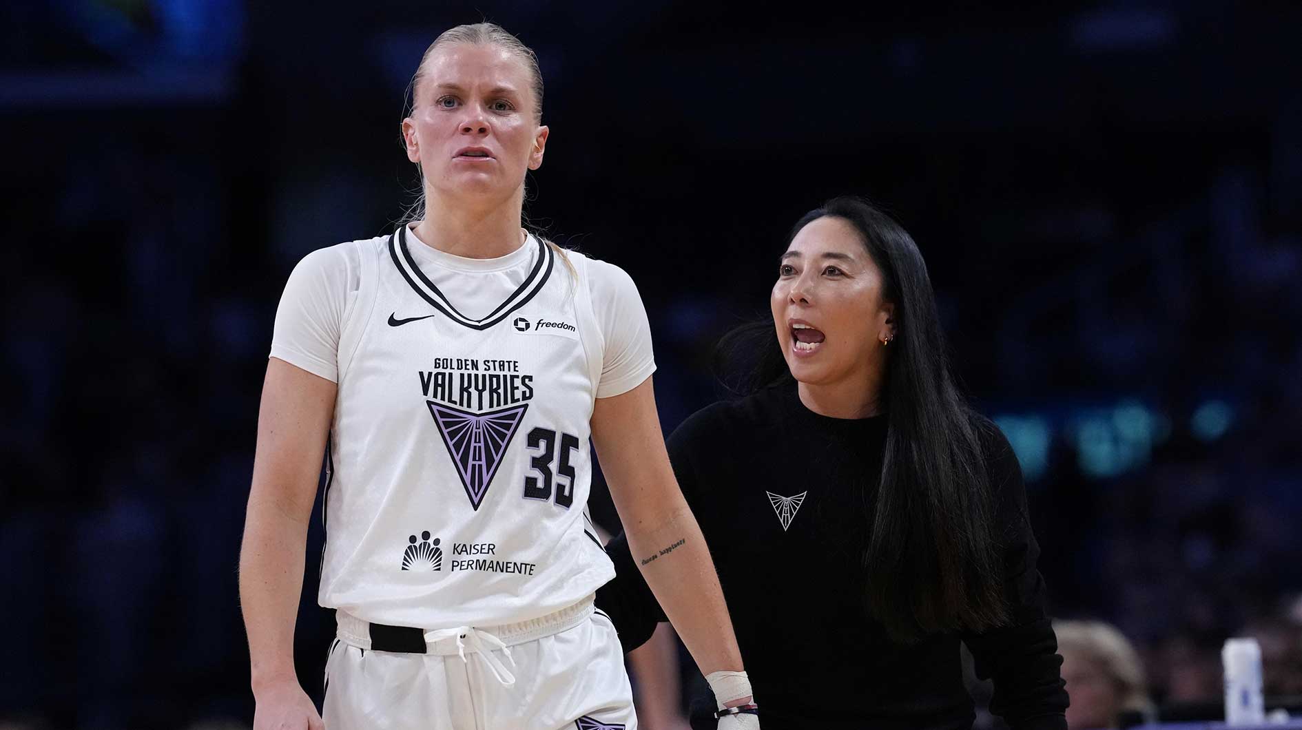Golden State Valkyries coach Natalie Nakase (right) talks with guard Julie Vanloo (35) in the first half against the LA Sparks at Crypto.com Arena.