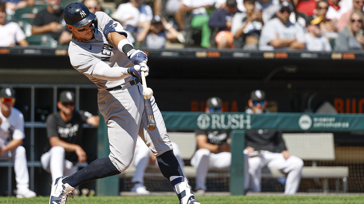 New York Yankees designated hitter Aaron Judge (99) singles against the Chicago White Sox during the fifth inning at Rate Field.