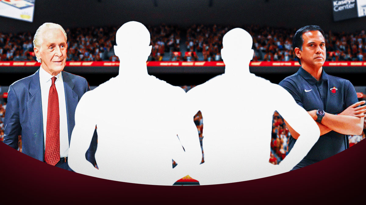 Silhouettes of Miami Heat stars Andrew Wiggins and Terry Rozier in the center with Pat Riley and Erik Spoelstra on either side in front of Kaseya Center.