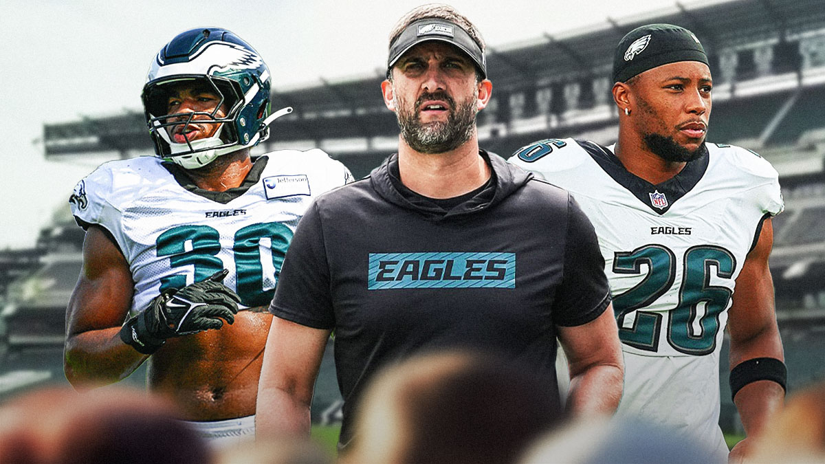 Nick Sirianni, Saquon Barkley, and Jihaad Campbell in front of the Eagles stadium.