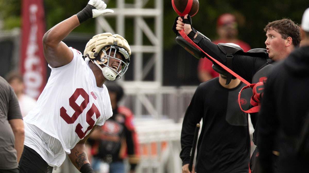 San Francisco 49ers defensive end Alfred Collins (95) swats at a ball during a pass rushing drill on the second day of training camp.