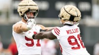 San Francisco 49ers defensive ends Nick Bosa (97) and Mykel Williams (98) work on their pass rushing skills during the second day of training camp.