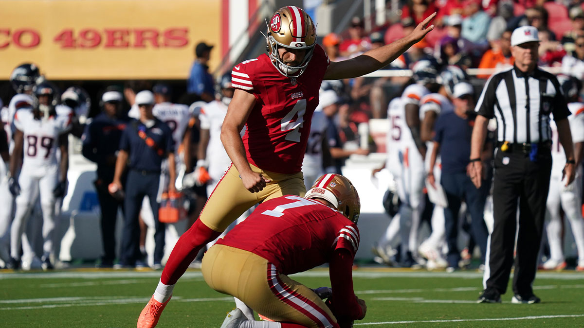 San Francisco 49ers kicker Jake Moody (4) kicks an extra point as punter Thomas Morstead (7) holds the ball in the first quarter against the Denver Broncos at Levi's Stadium.