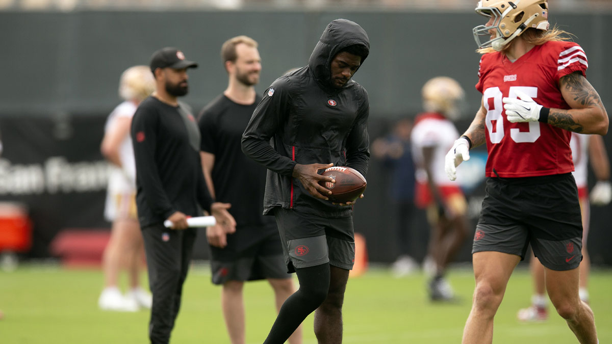 Still recovering from knee surgery, San Francisco 49ers wide receiver Brandon Aiyuk (left) hangs out with teammate George Kittle (85) during the second day of training camp.