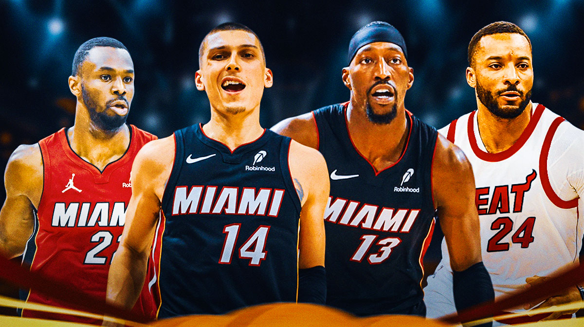 Miami Heat stars Tyler Herro and Bam Adebayo in the middle with Andrew Wiggins and Norman Powell on either side in front of Kaseya Center.