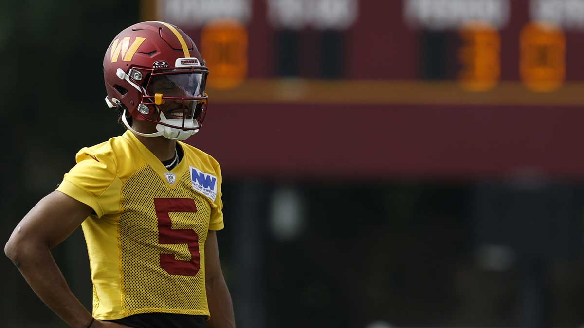 Washington Commanders quarterback Jayden Daniels (5) looks on during practice on day one of training camp at OrthoVirginia Training Center at Commanders Park. 