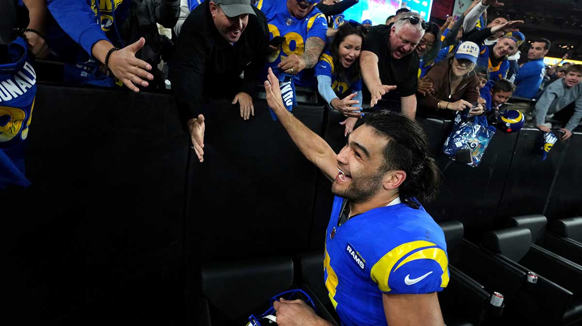 Los Angeles Rams receiver Puka Nacua (17) high-fives fans after their 27-9 playoff win over the Minnesota Vikings at State Farm Stadium on Jan. 13, 2025, in Glendale.