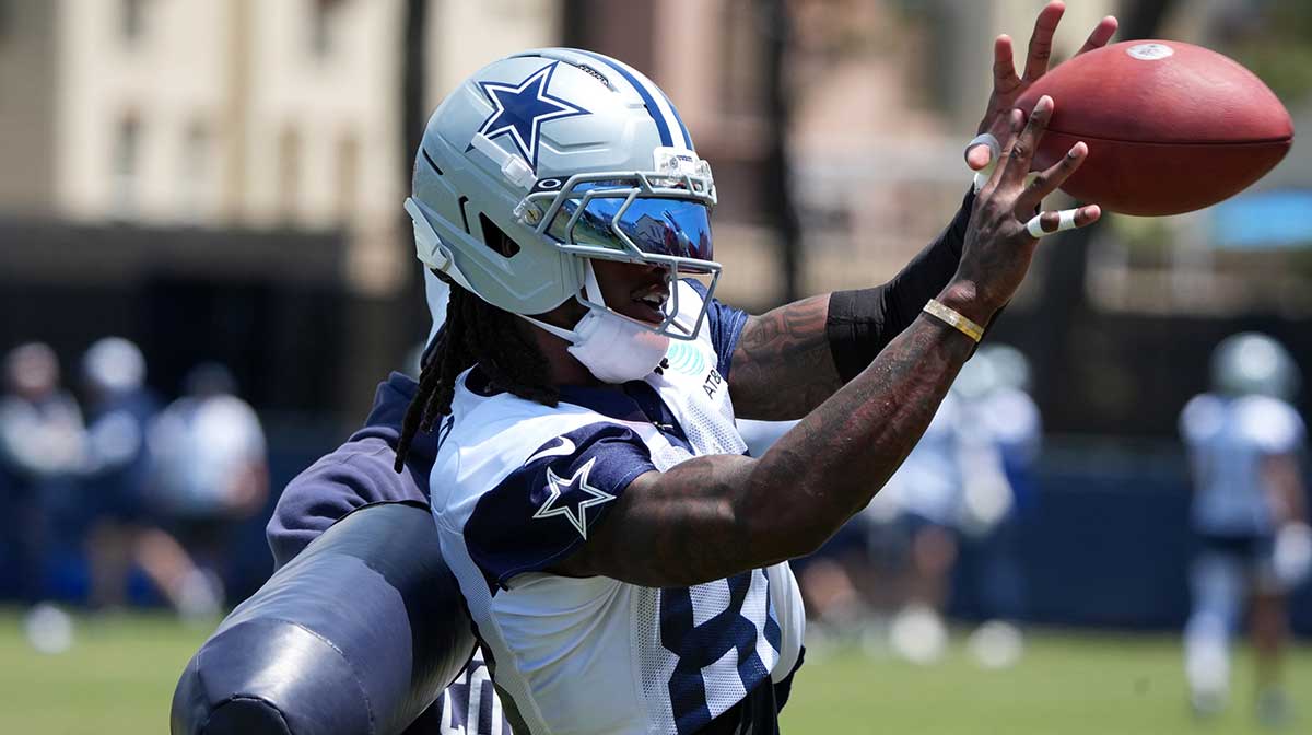 Dallas Cowboys receiver CeeDee Lamb (88) catches the ball at training camp at the River Ridge Fields.
