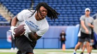 Detroit Lions running back Jahmyr Gibbs (0) warms up ahead of the Hall of Fame Game at Tom Benson Hall of Fame Stadium in Canton, Ohio on Thursday, July 31, 2025
