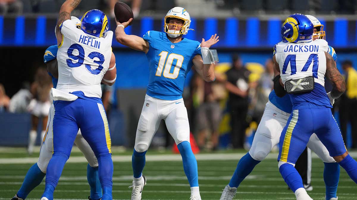 Los Angeles Chargers quarterback Justin Herbert (10) throws the ball against the Los Angeles Rams in the first half at SoFi Stadium. 