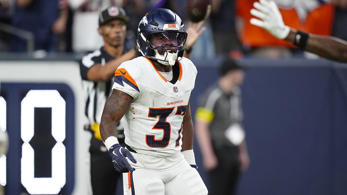 Denver Broncos running back RJ Harvey (37) celebrates his rushing touchdown in the first quarter against the Arizona Cardinals at Empower Field at Mile High.