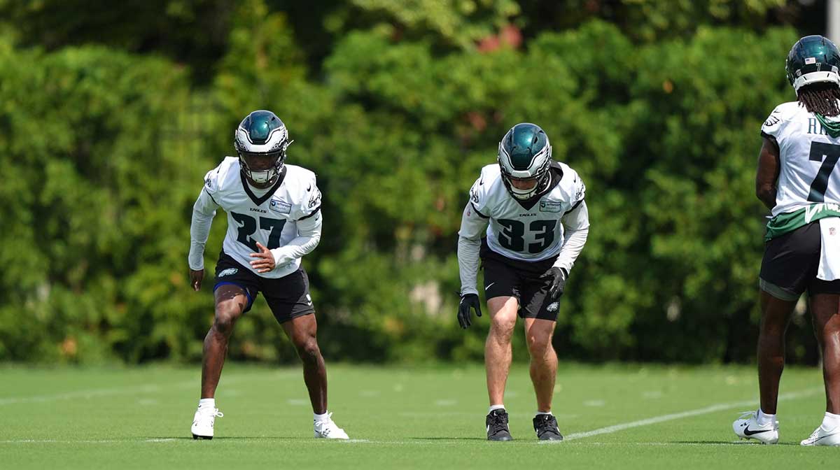 Philadelphia Eagles defensive back Quinyon Mitchell (27) performs a practice drill with defensive back Cooper DeJean (33) at NovaCare Complex.