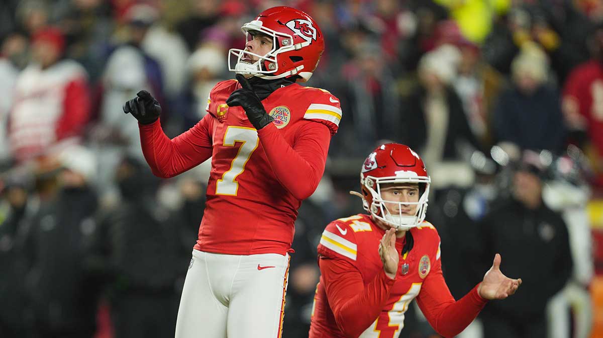 Kansas City Chiefs place kicker Harrison Butker (7) reacts after kicking a 27 yard field goal from the hold of punter Matt Araiza (14) against the Houston Texans during the fourth quarter of a 2025 AFC divisional round game at GEHA Field at Arrowhead Stadium. 