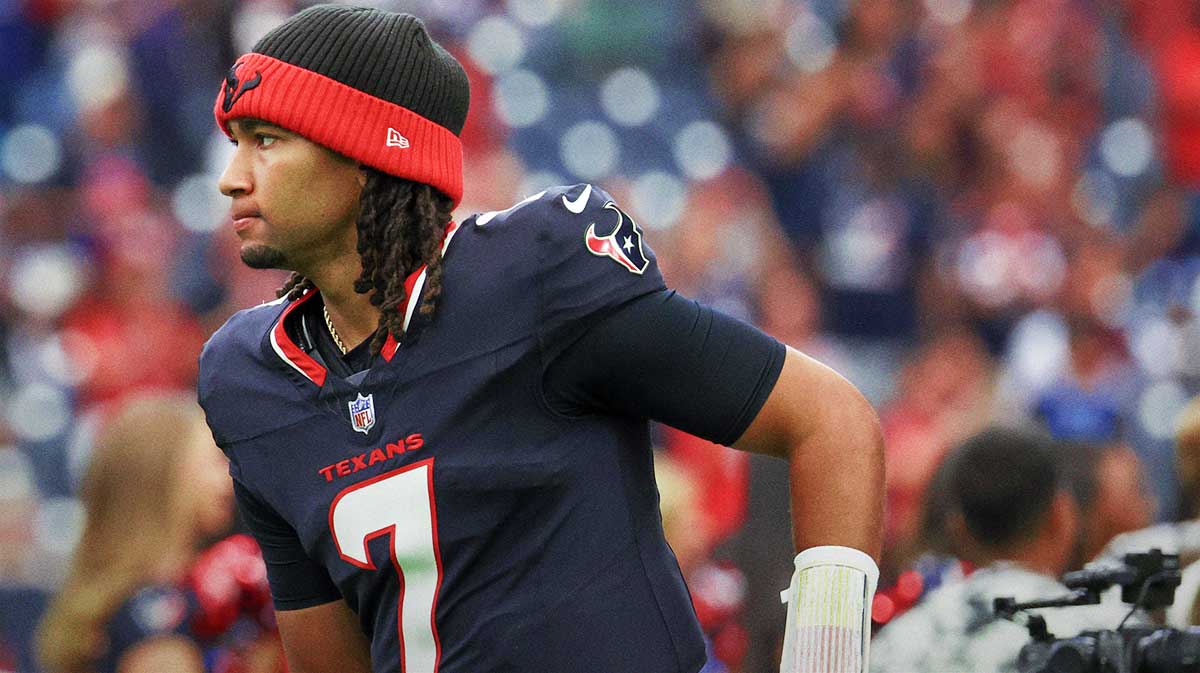 Houston Texans quarterback C.J. Stroud (7) runs out of the tunnel onto the field before playing against the Carolina Panthers at NRG Stadium.