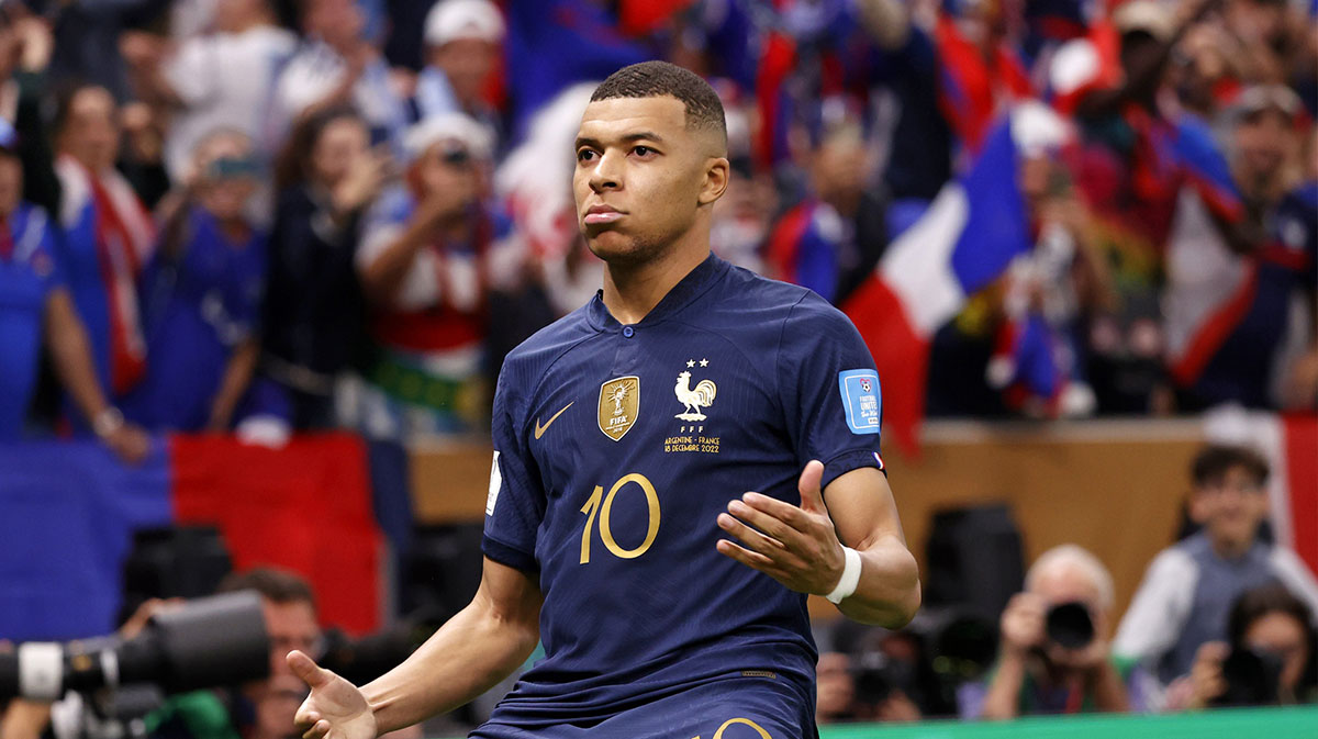France forward Kylian Mbappe (10) celebrates after scoring a goal against Argentina on a penalty kick for his third goal of the match during extra time of the 2022 World Cup final at Lusail Stadium. 
