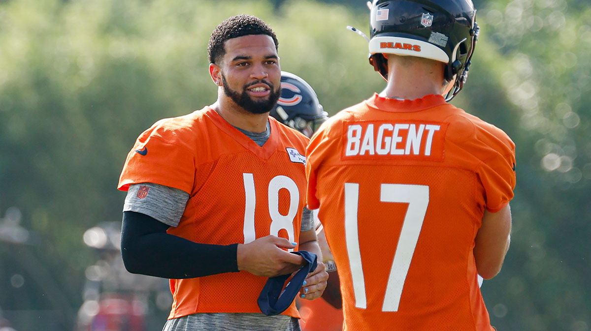 Chicago Bears quarterback Caleb Williams (18) chats with quarterback Tyson Bagent (17) during training camp at Halas Hall.