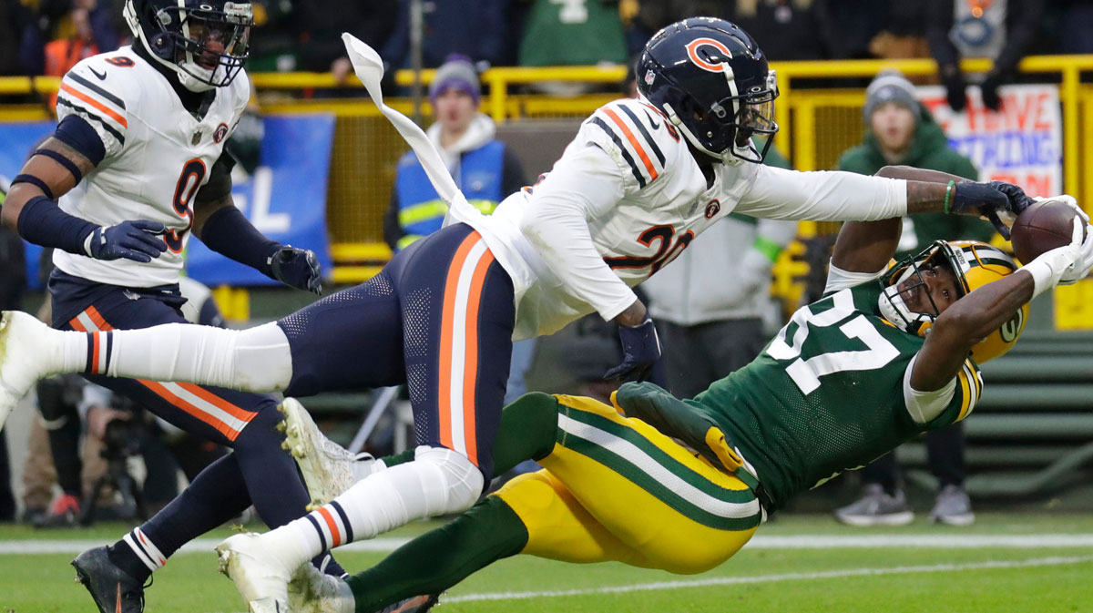 Chicago Bears cornerback Tyrique Stevenson (29) breaks up a potential touchdown reception against Green Bay Packers wide receiver Romeo Doubs (87) in the first half during their football game Sunday, January 7, 2024, in Green Bay, Wisconsin.