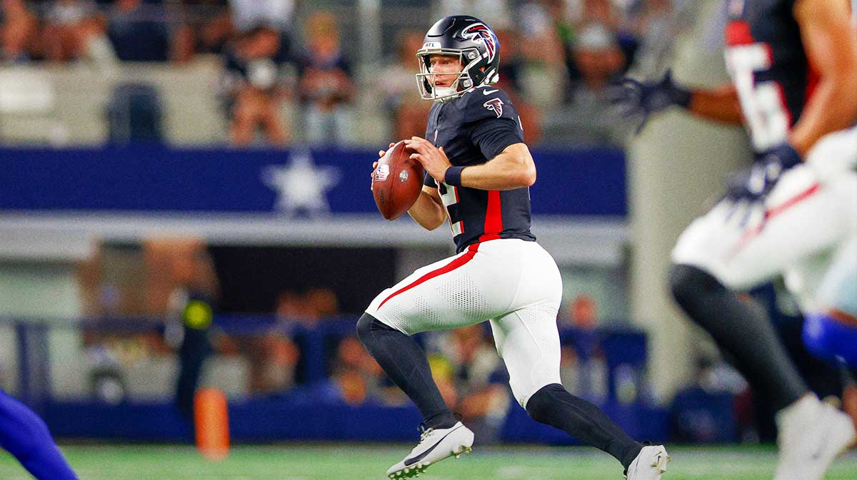 Atlanta Falcons quarterback Easton Stick (12) scrambles during the second quarter against the Dallas Cowboys at AT&T Stadium. 