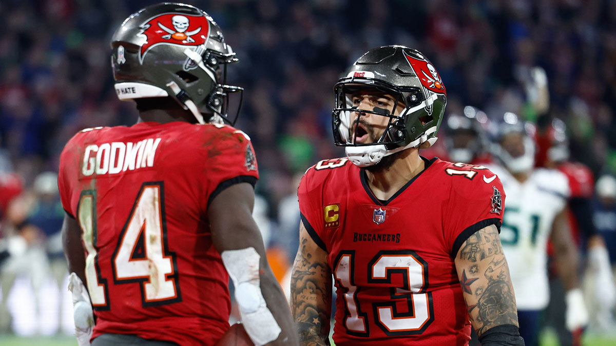 Tampa Bay Buccaneers wide receiver Chris Godwin (14) celebrates his touchdown with teammate wide receiver Mike Evans (13) against the Seattle Seahawks during the fourth quarter of an International Series game at Allianz Arena.