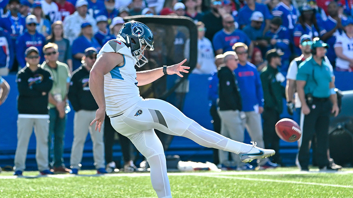 Tennessee Titans punter Ryan Stonehouse (4) makes contact with the ball in the fourth quarter against the Buffalo Bills at Highmark Stadium.