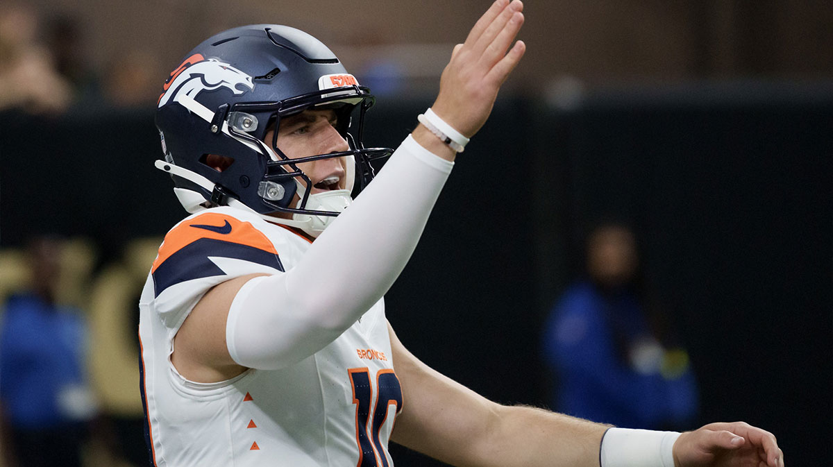 Denver Broncos quarterback Bo Nix (10) signals a first down against the New Orleans Saints during the first half at Caesars Superdome.