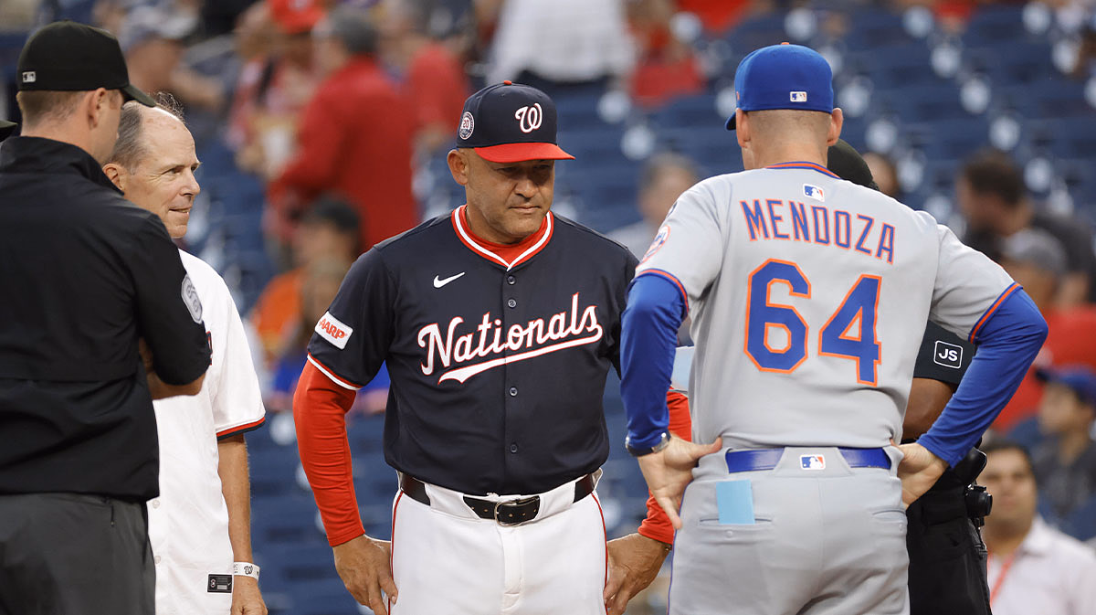 Washington Nationals interim manager Miguel Cairo (22) and New York Mets manager Carlos Mendoza (64) meet at home plate prior to their game at Nationals Park.