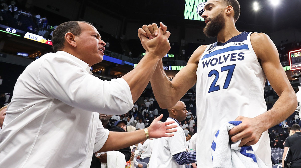 Minnesota Timberwolves center Rudy Gobert (27) and owner Alex Rodriguez celebrate after the win of game four of the 2023 NBA Playoffs against the Denver Nuggets at Target Center.