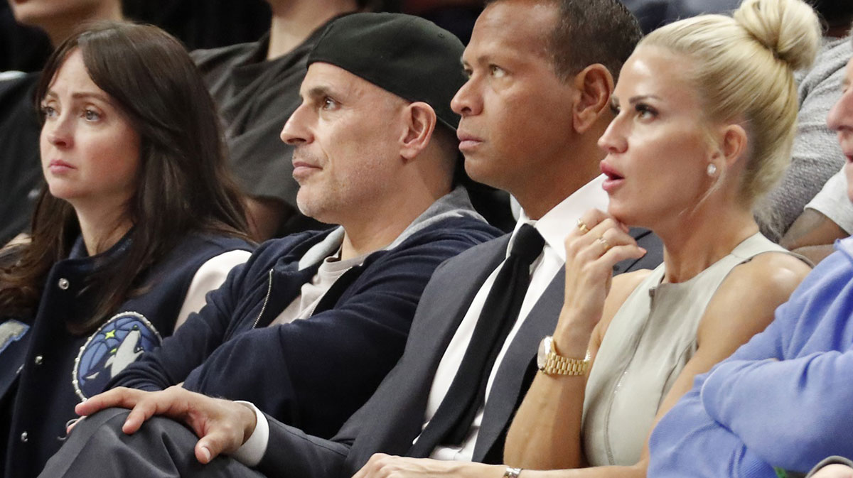 Minnesota Timberwolves and Lynx minority owners Marc Lore and Alex Rodriguez watch in the fourth quarter of the game against the Phoenix Suns at Target Center.