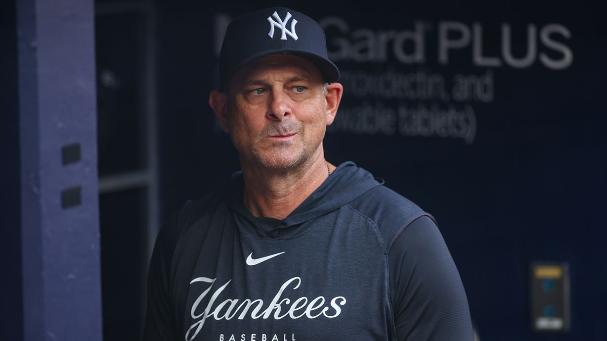 New York Yankees manager Aaron Boone (17) in the dugout before a game against the Atlanta Braves at Truist Park.