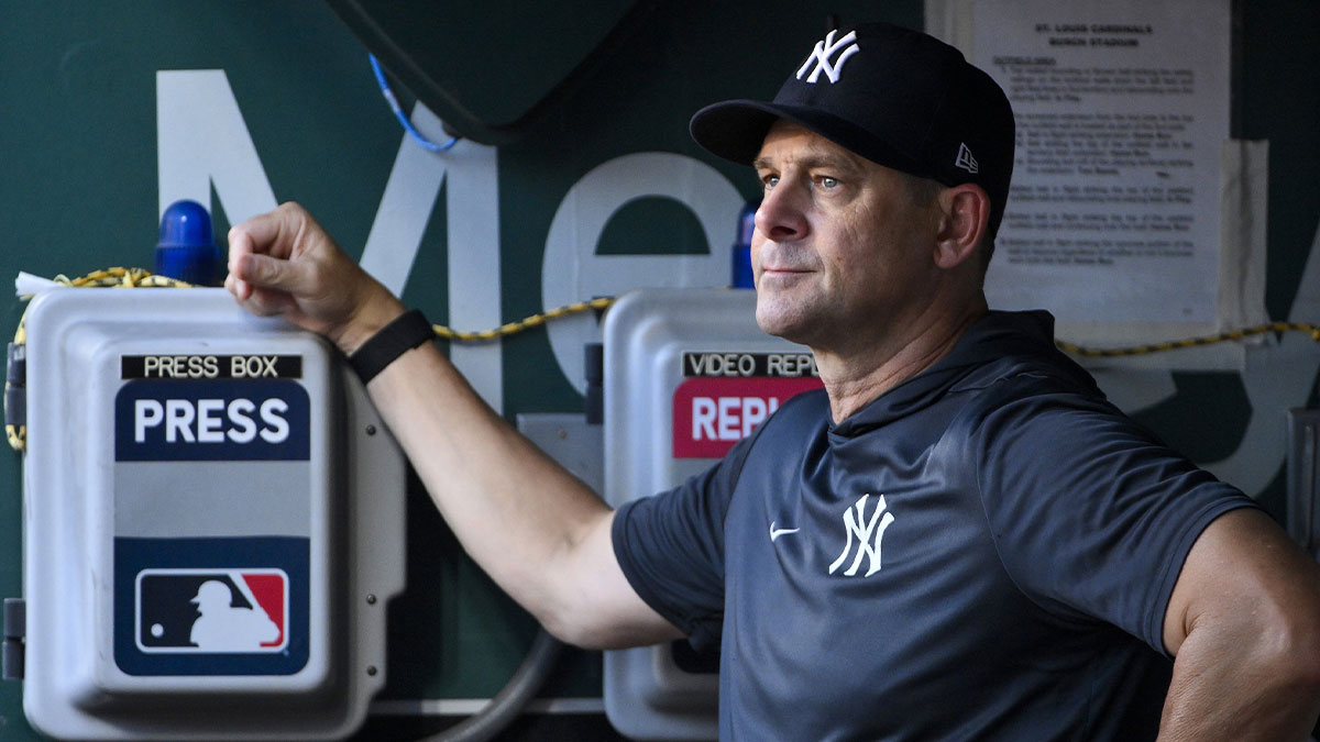 New York Yankees manager Aaron Boone (17) looks on from the dugout before a game against the St. Louis Cardinals at Busch Stadium.