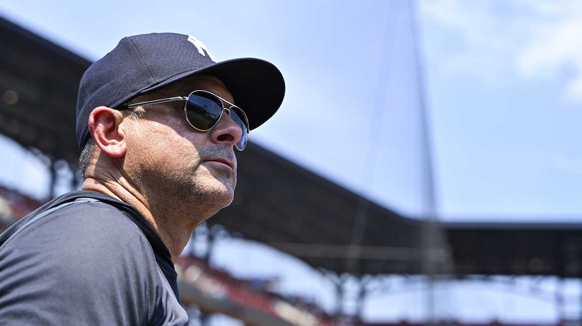New York Yankees manager Aaron Boone (17) looks on from the dugout during the third inning against the St. Louis Cardinals at Busch Stadium.