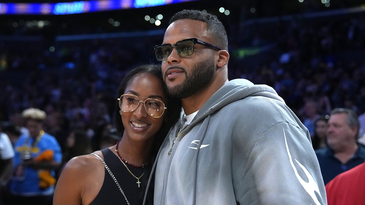 Los Angeles Rams former defensive end Aaron Donald (right) and wife Erica Donald pose during the WNBA game between the Chicago Sky and the LA Sparks at Crypto.com Arena.