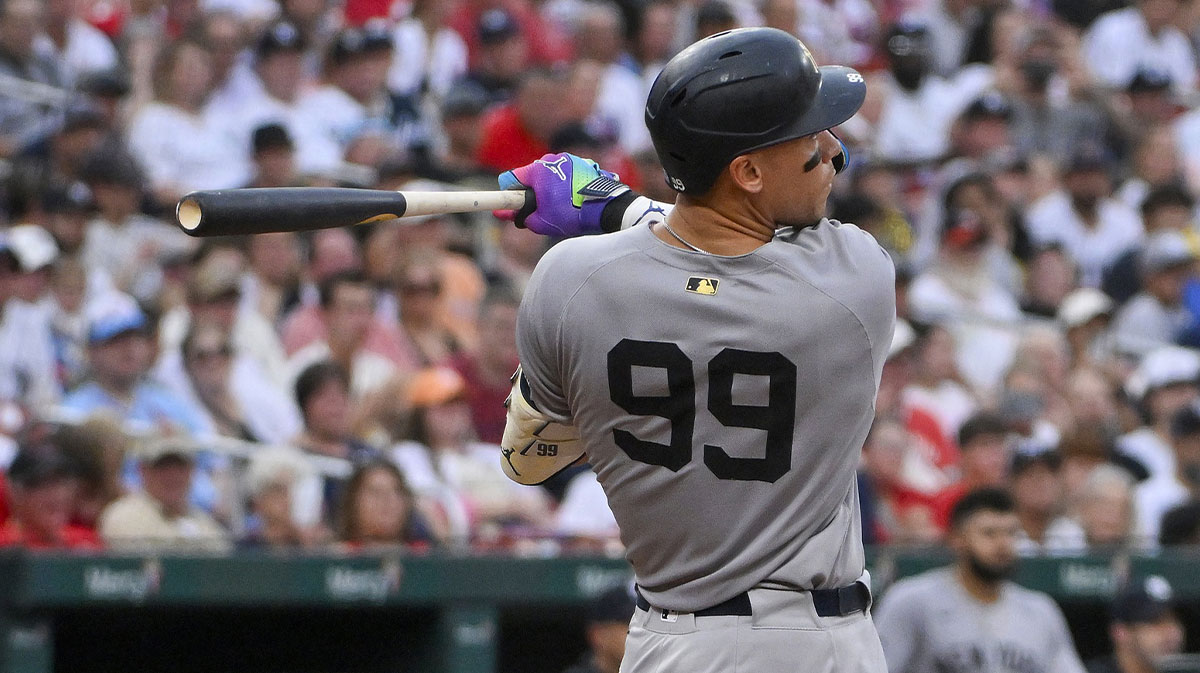 New York Yankees designated hitter Aaron Judge (99) hits a solo home run against the St. Louis Cardinals during the third inning at Busch Stadium.