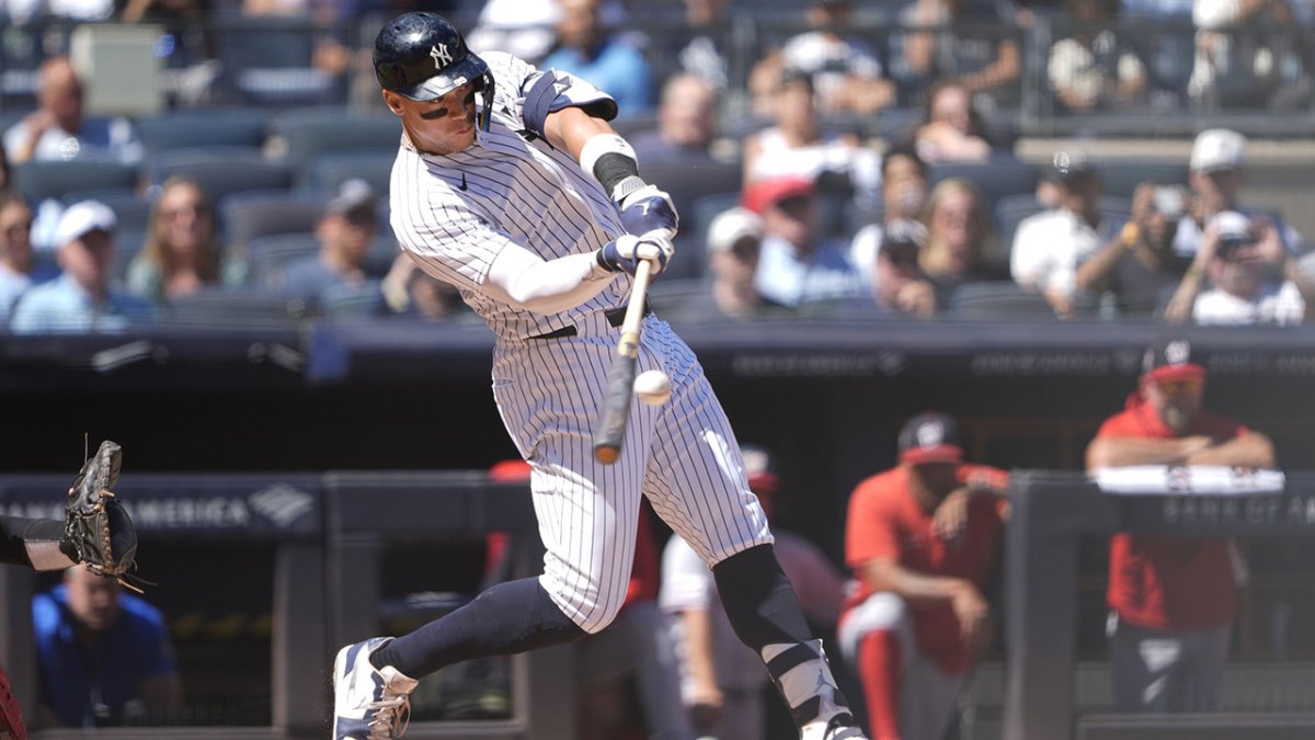 New York Yankees designated hitter Aaron Judge (99) hits a two run home run against the Washington Nationals during the third inning at Yankee Stadium.