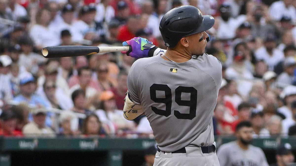 New York Yankees designated hitter Aaron Judge (99) hits a solo home run against the St. Louis Cardinals during the third inning at Busch Stadium.