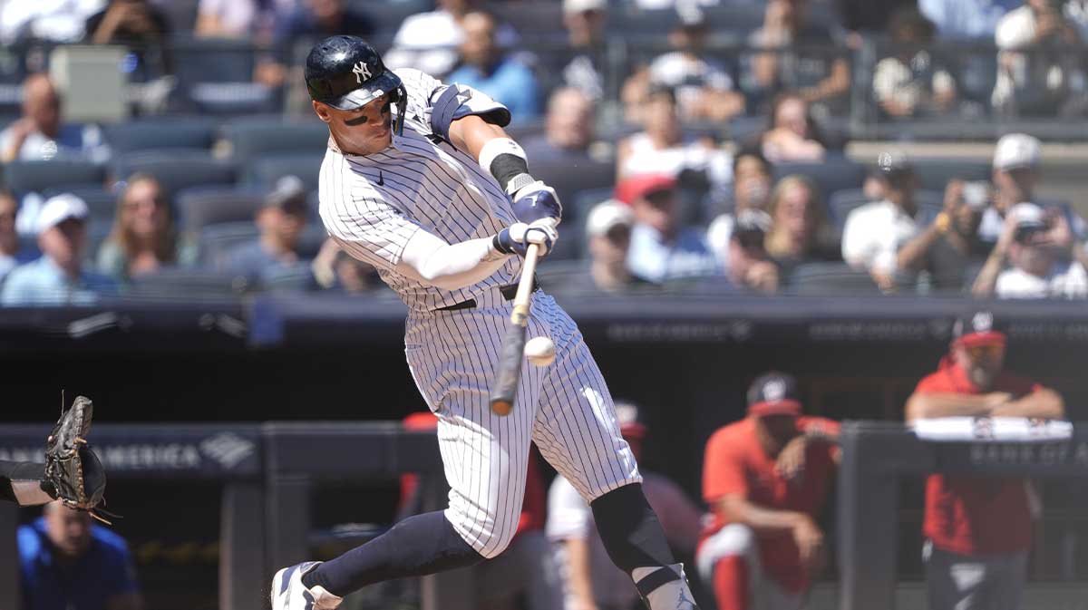 New York Yankees designated hitter Aaron Judge (99) hits a two run home run against the Washington Nationals during the third inning at Yankee Stadium.
