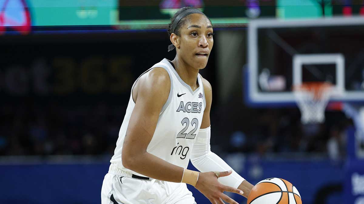 Las Vegas Aces center A'ja Wilson (22) looks to pass the ball against the Chicago Sky during the second half at Wintrust Arena.
